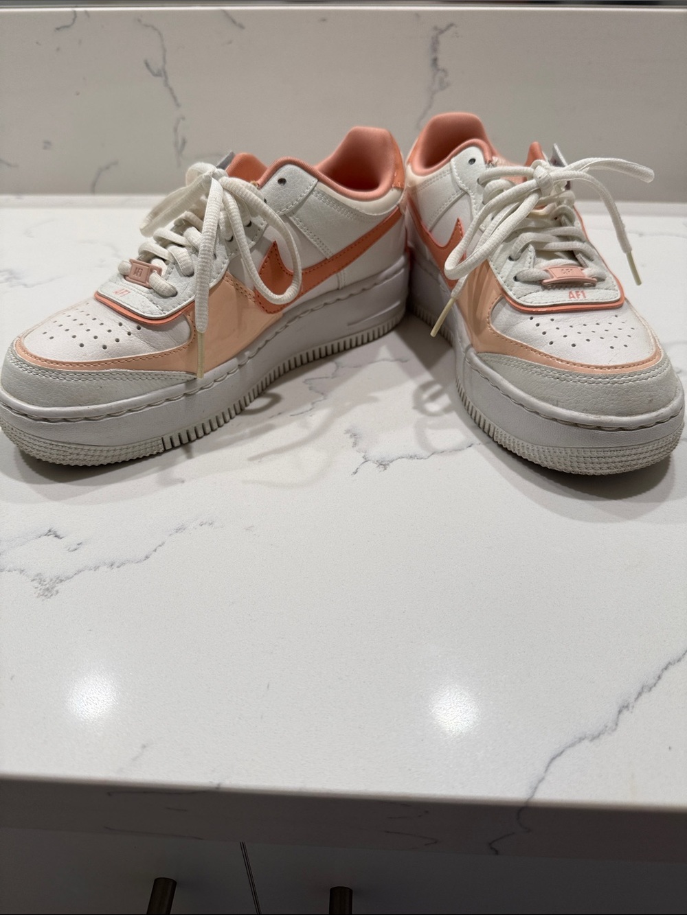 Nike Women’s Low-Top Sneakers in White and Peach
